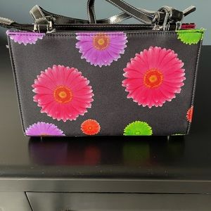 Black purse with colorful flowers